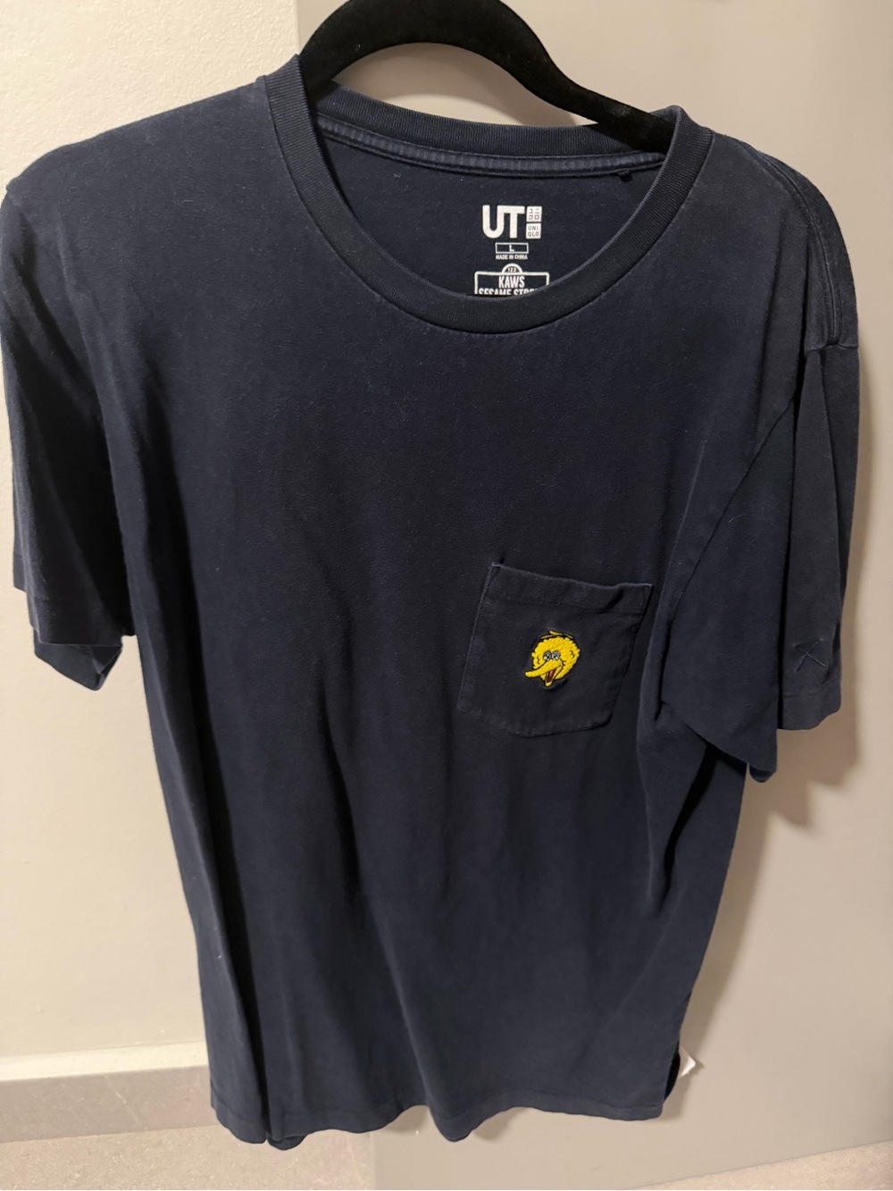 KAWS SESAME STREET UNIQLO Navy Pocket Tee with Yellow Big Bird Patch